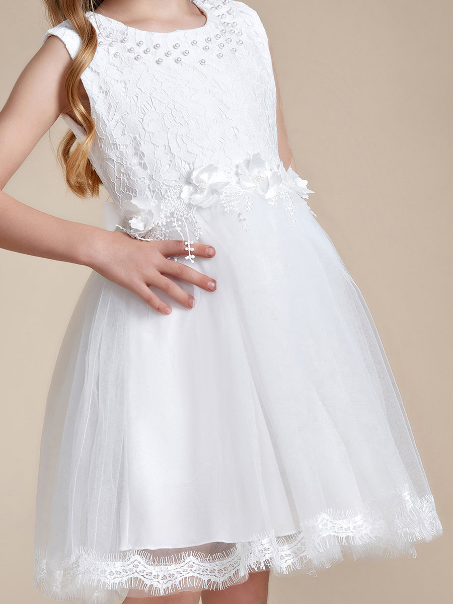 Abito da sposa bianco in tulle e pizzo con fiocco posteriore