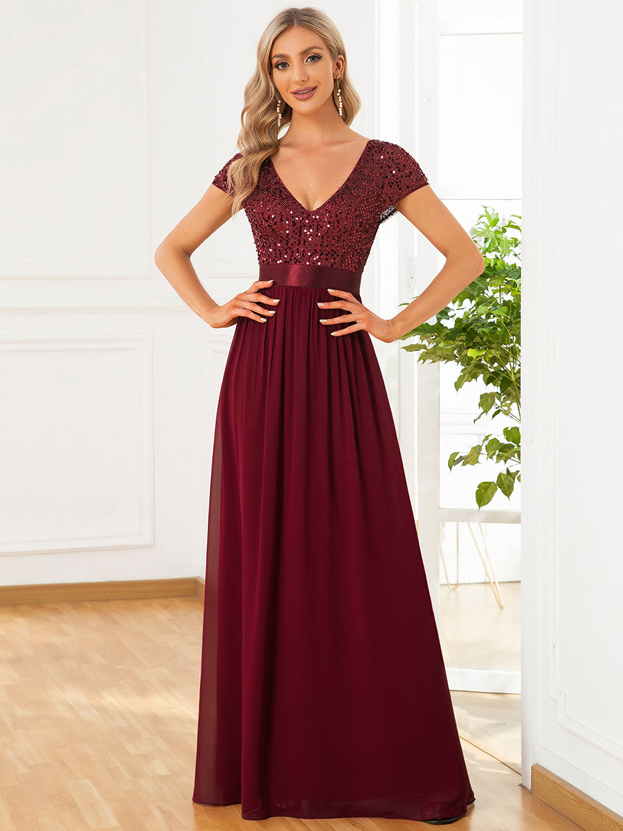 Abito da sera in paillettes e chiffon con scollo a V e vita impero