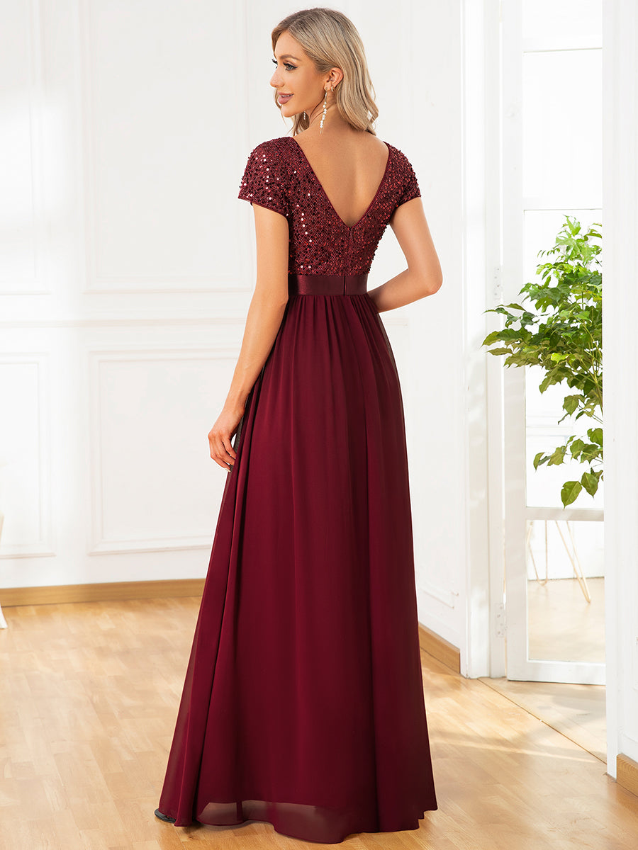 Abito da sera in paillettes e chiffon con scollo a V e vita impero