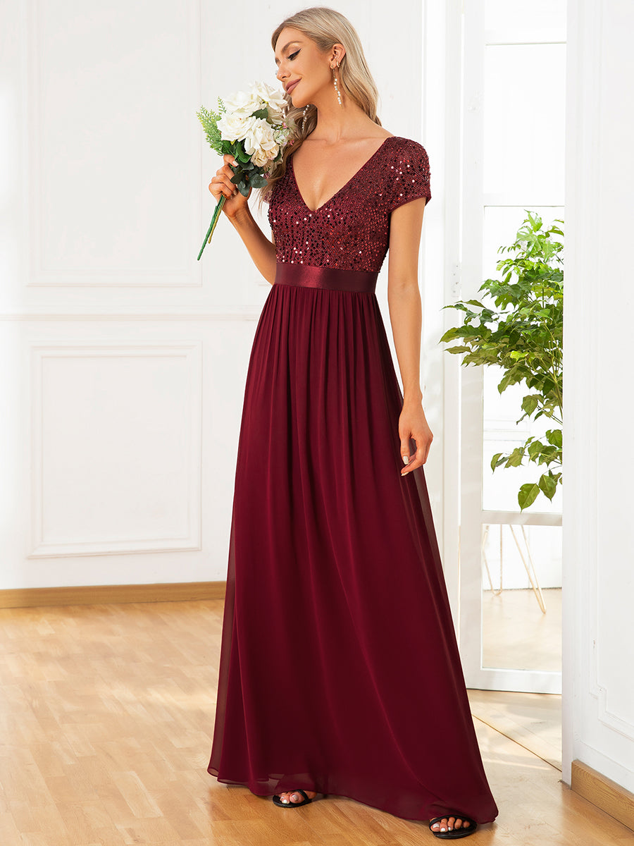 Abito da sera in paillettes e chiffon con scollo a V e vita impero