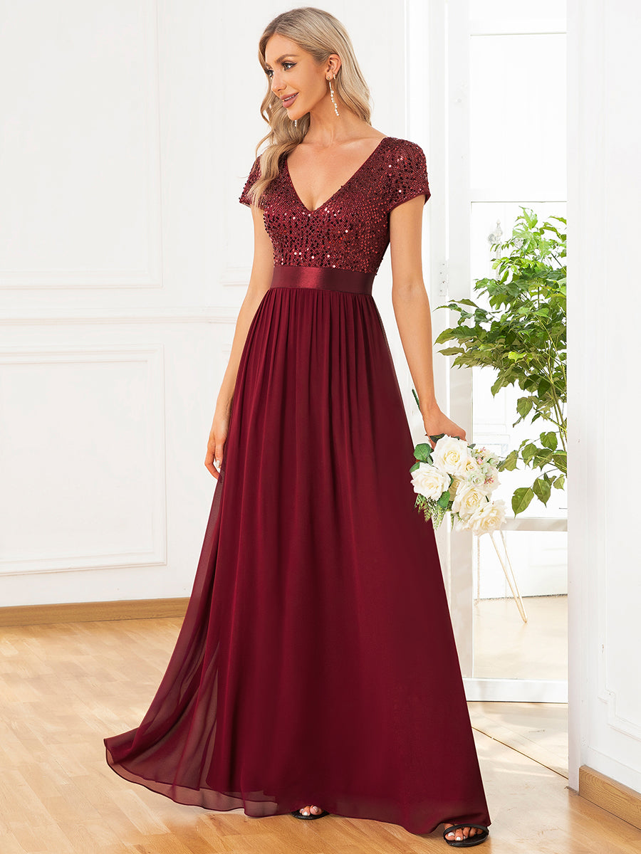 Abito da sera in paillettes e chiffon con scollo a V e vita impero