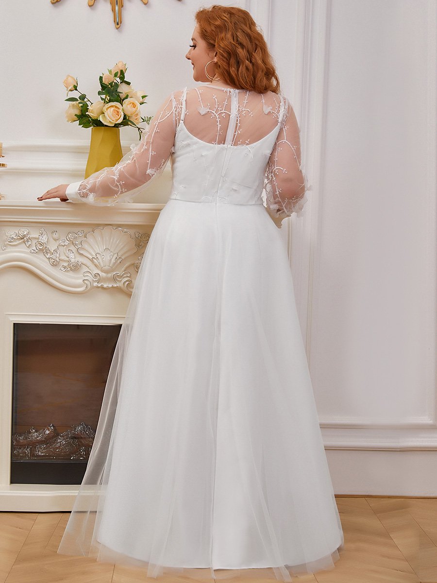 Abito da sposa a trapezio con maniche lunghe e ampio tulle