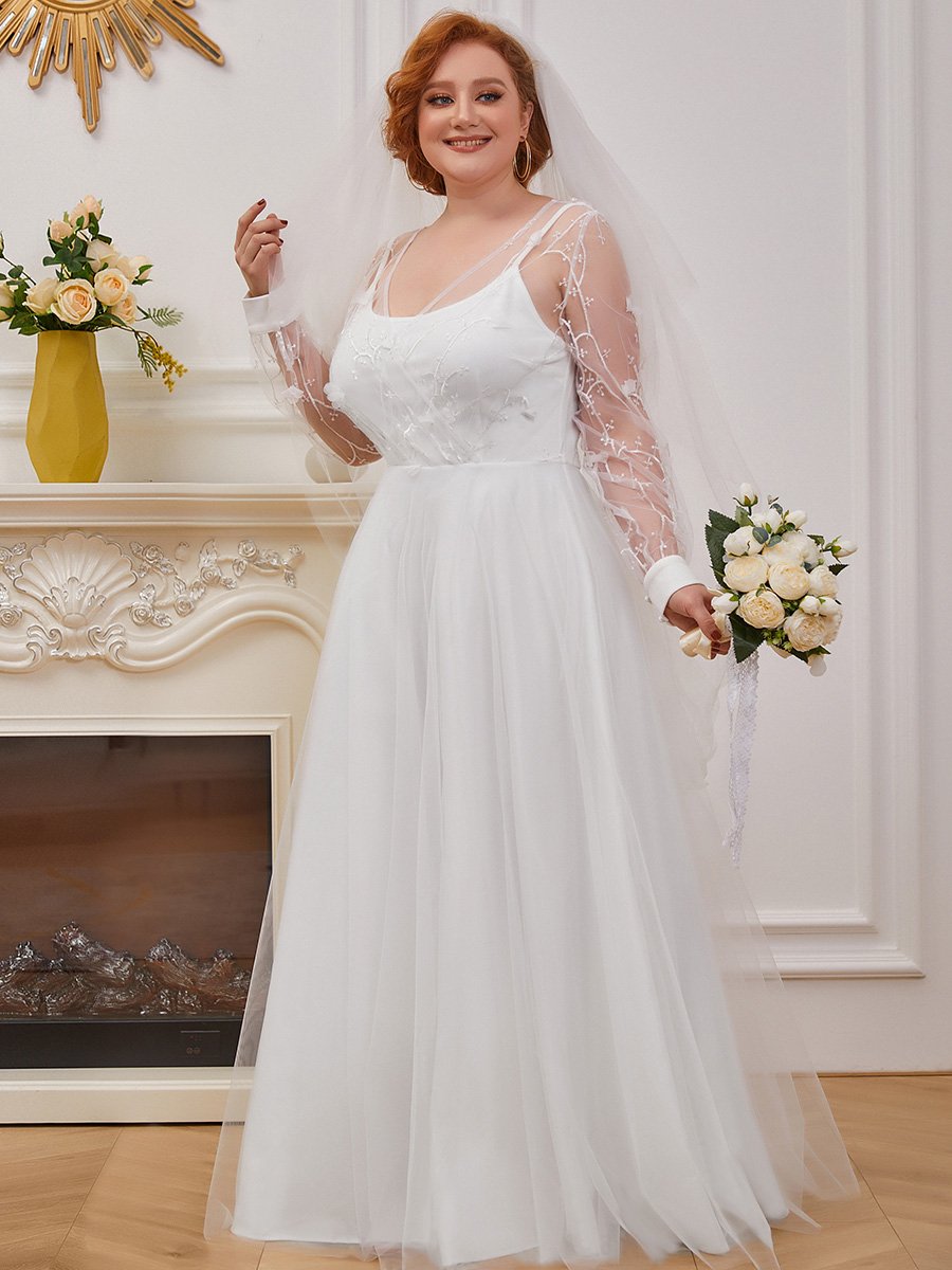 Abito da sposa a trapezio con maniche lunghe e ampio tulle