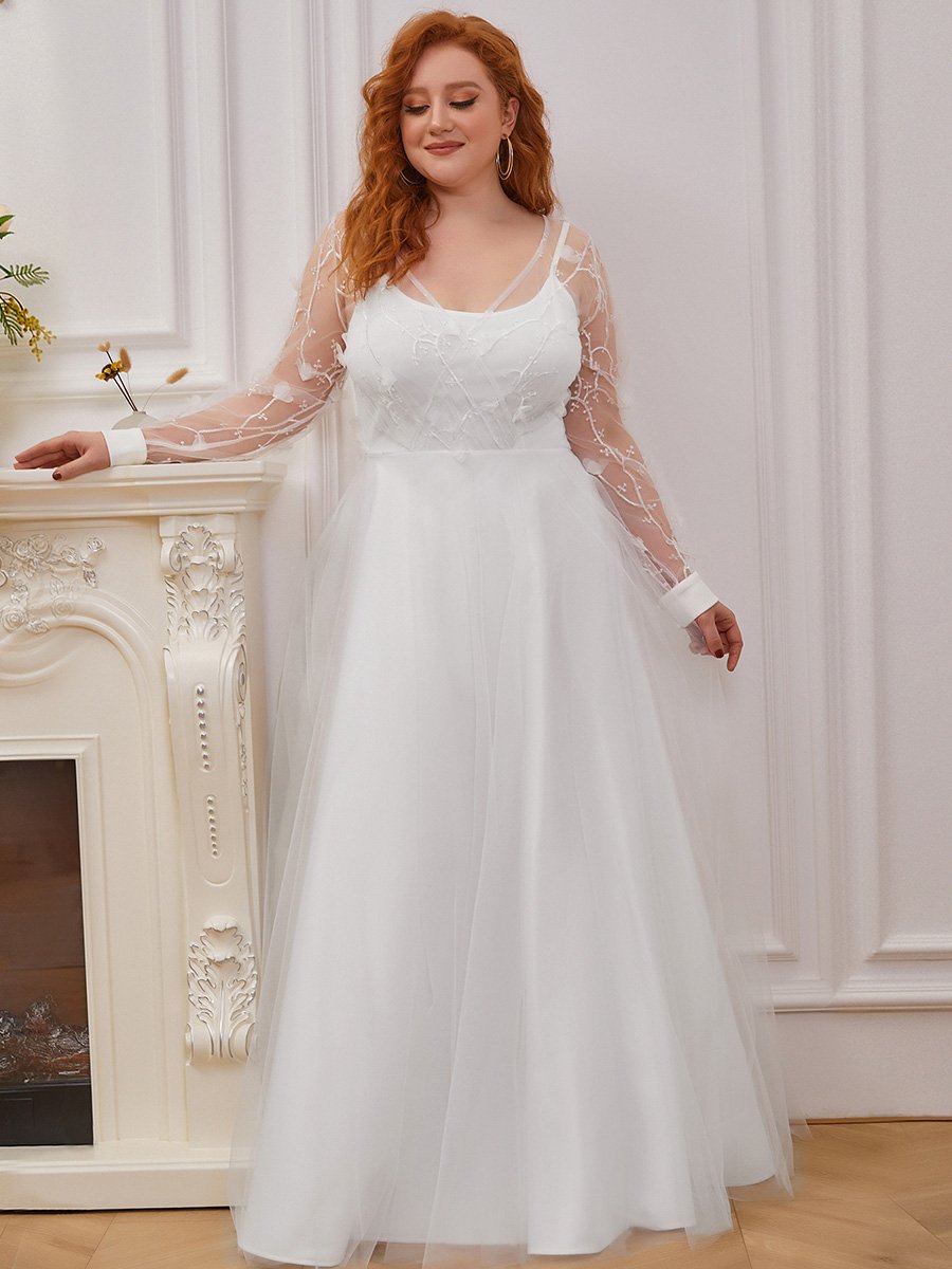 Abito da sposa a trapezio con maniche lunghe e ampio tulle