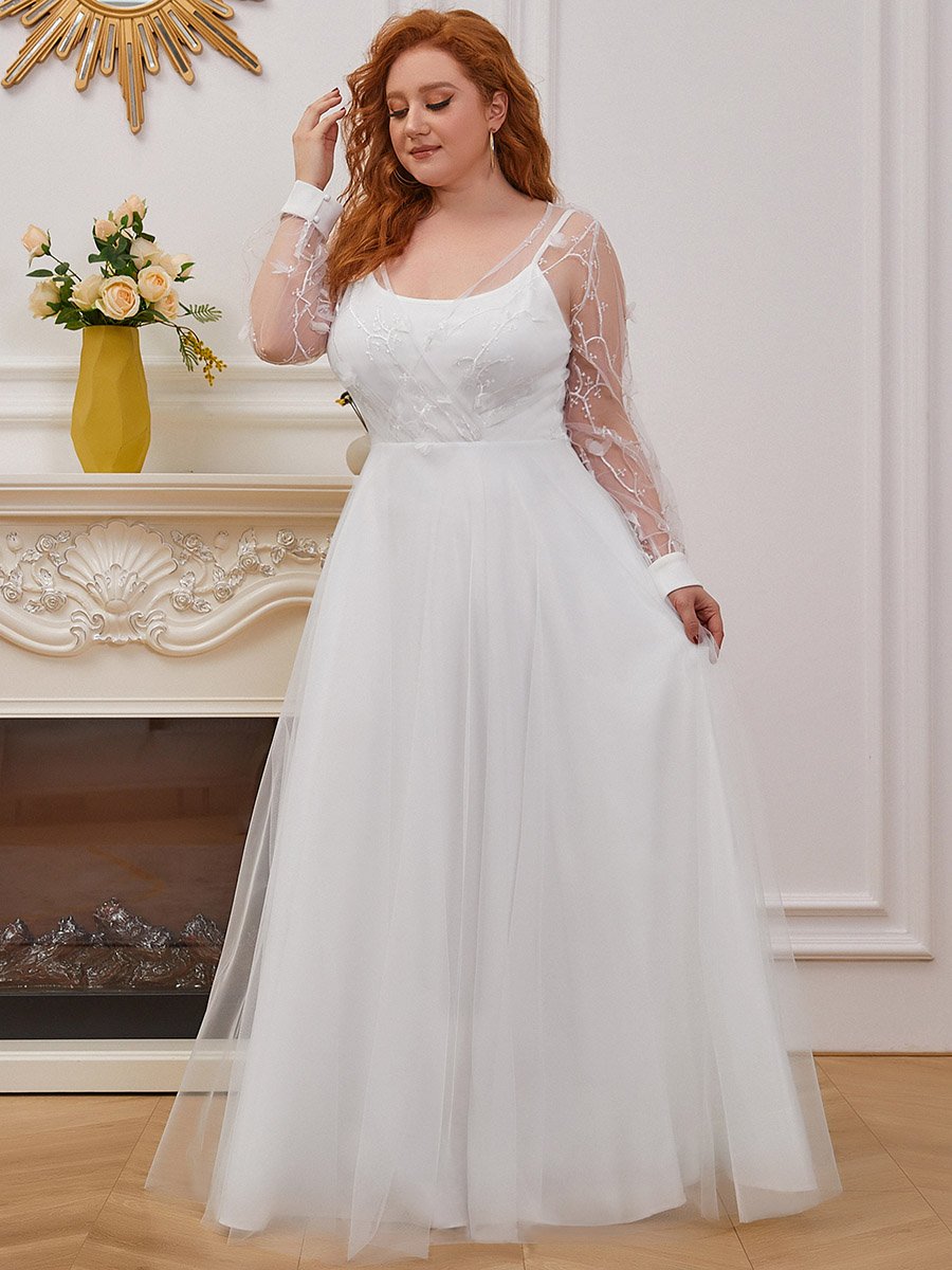 Abito da sposa a trapezio con maniche lunghe e ampio tulle