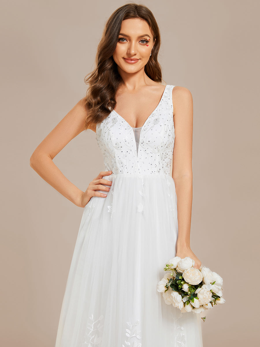 Abito da sposa a trapezio ricamato senza maniche con scollo a V