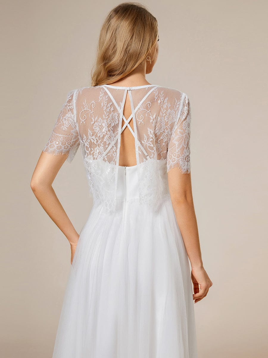 Abito da sposa a trapezio con giacca in pizzo e bretelle