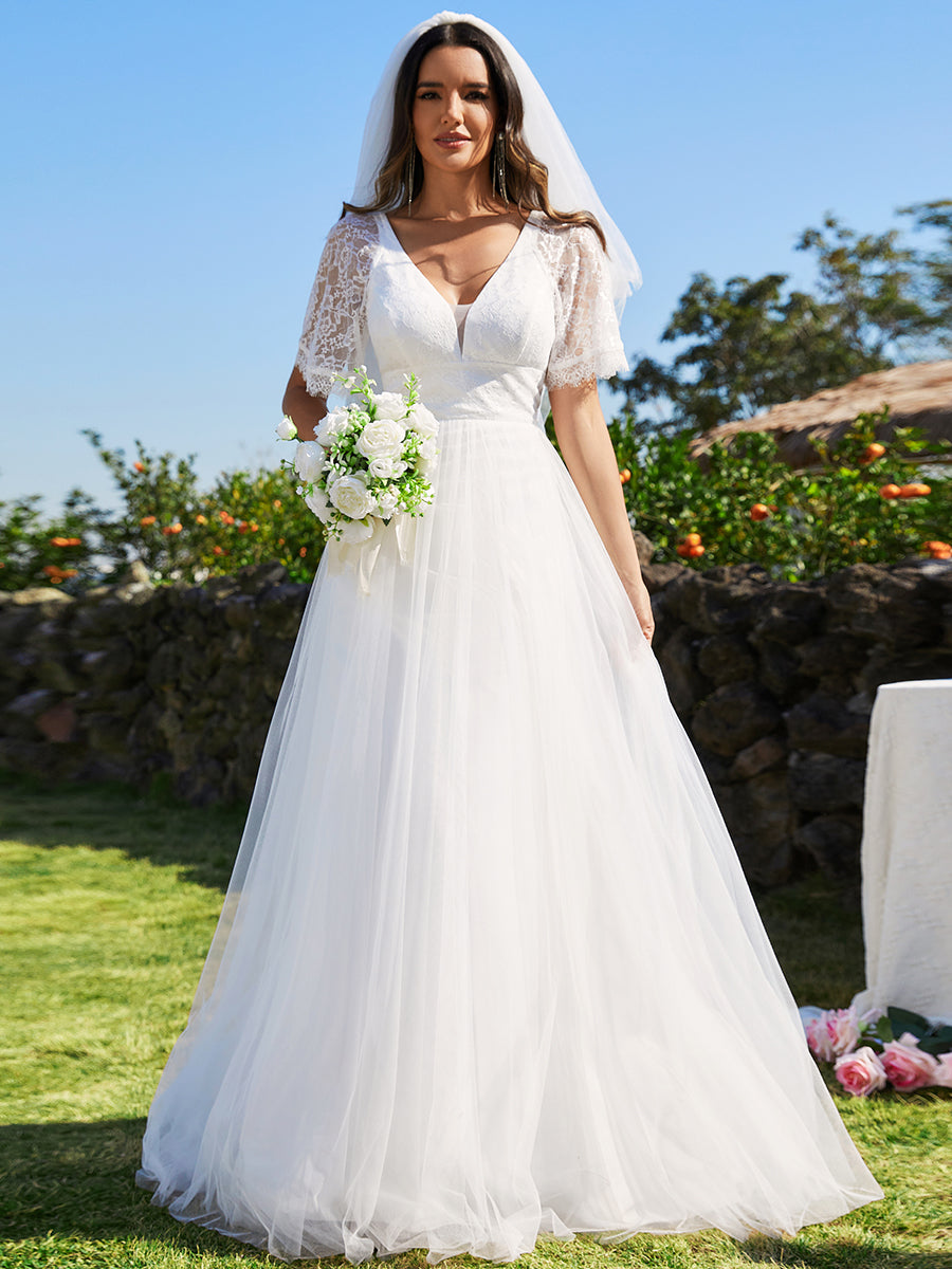 Abito da sposa in tulle con scollo a V e maniche plissettate