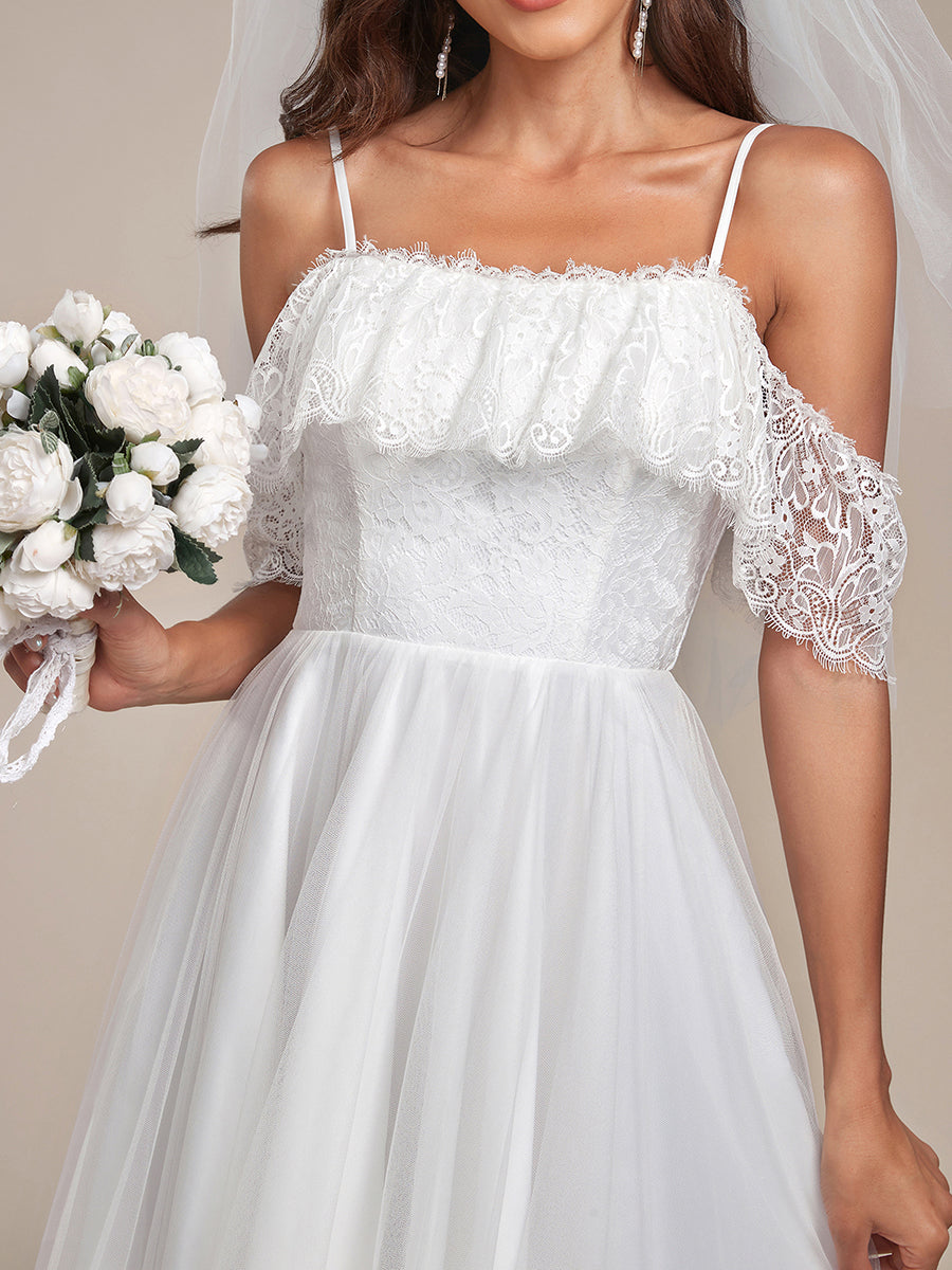 Abito da sposa in pizzo a spalla fredda con spalline alte e basse