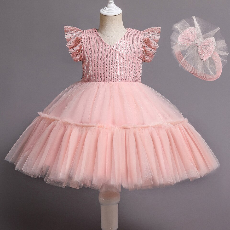 Rosa Babykleid mit Haarreifen