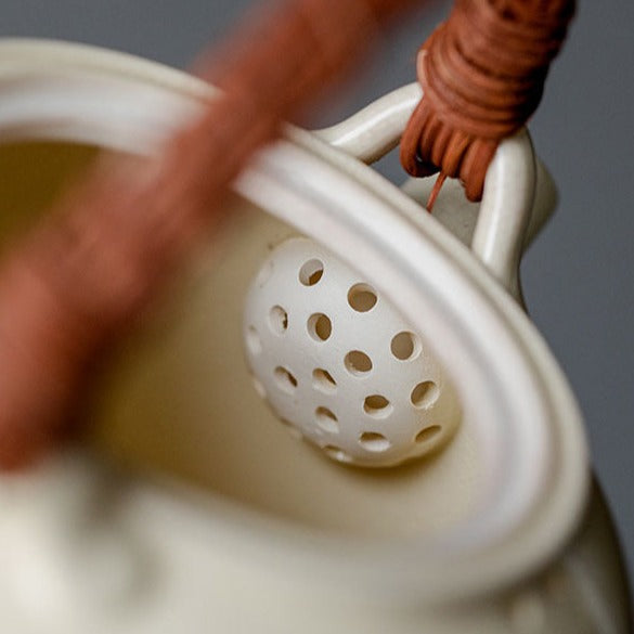 Porcelianinis arbatinukas su rotango rankena 0,39 - 1L