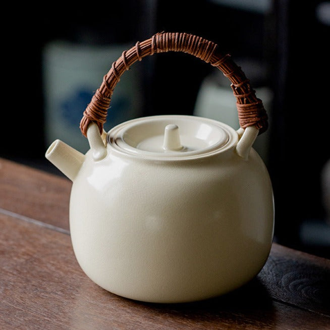 Porcelianinis arbatinukas su rotango rankena 0,39 - 1L