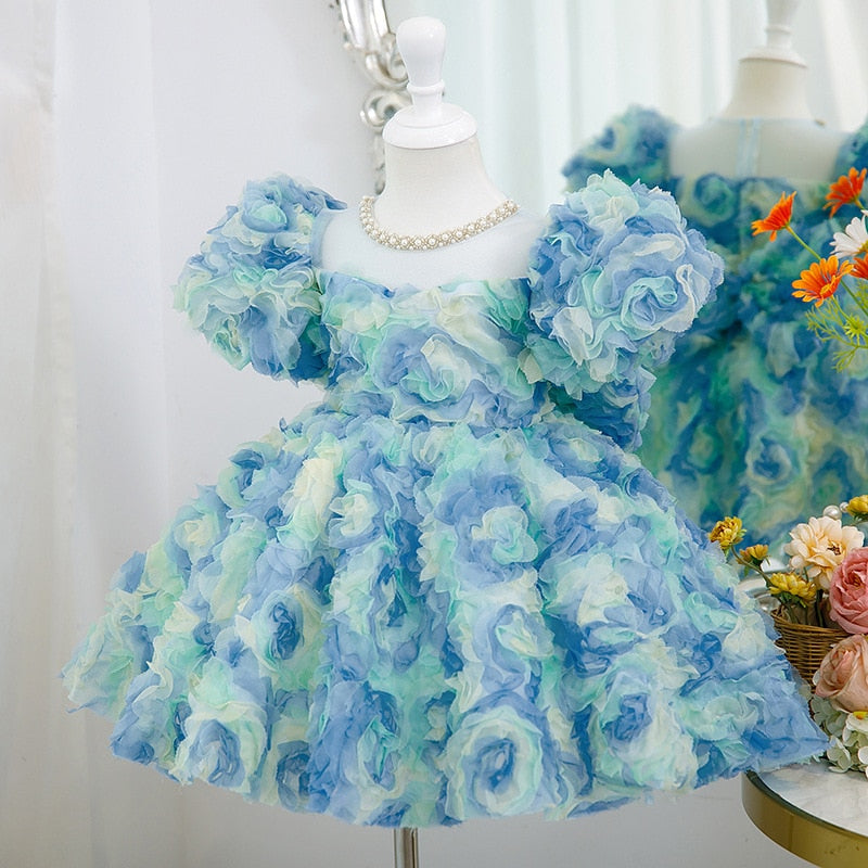 Vestido de cumpleaños con rosetón azul para niña