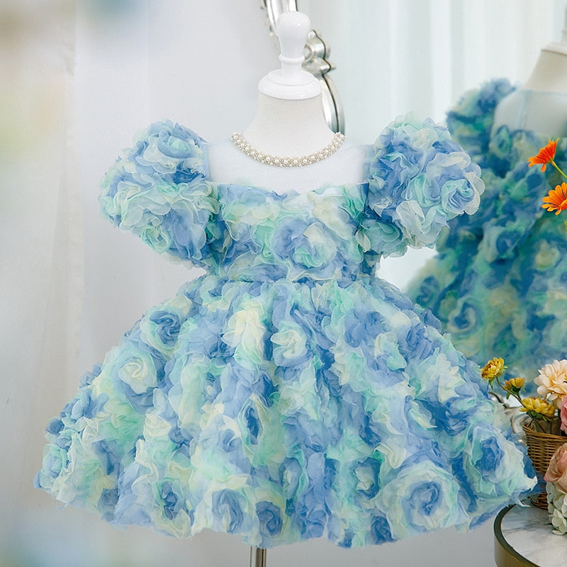 Vestido de cumpleaños con rosetón azul para niña