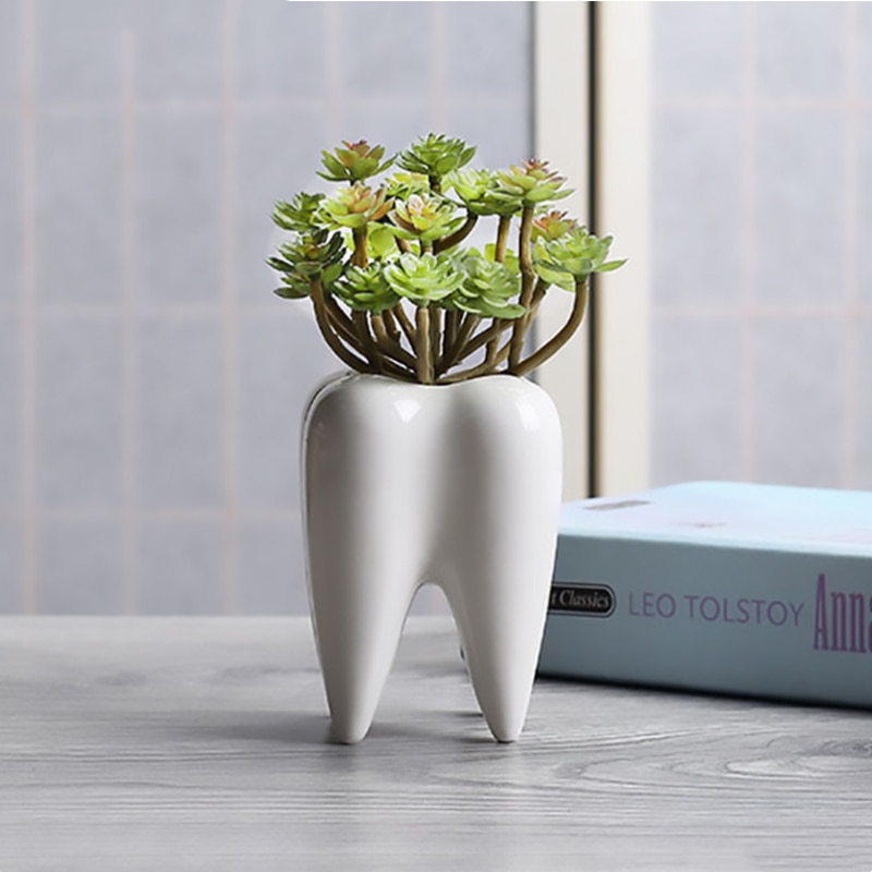 Vaso originale a forma di dente bianco